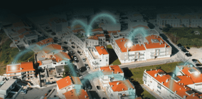 aerial view of a city with lines representing connections between houses